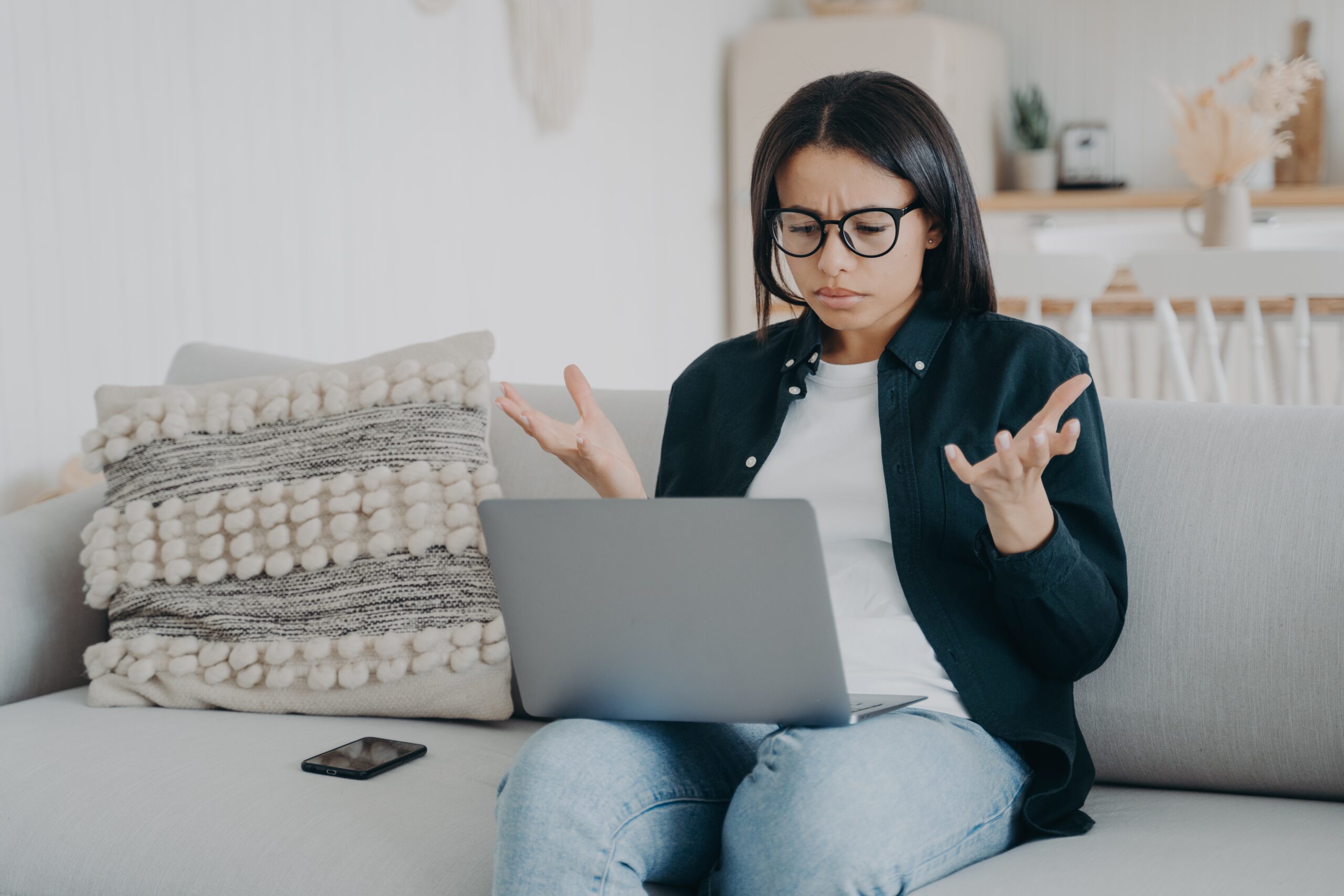 woman splashing hands having problems with why her laptop is so slow