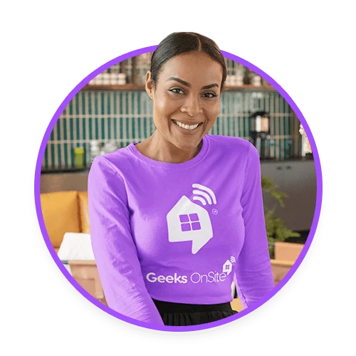 Female Geeks on Site employee in a purple long-sleeved shirt.